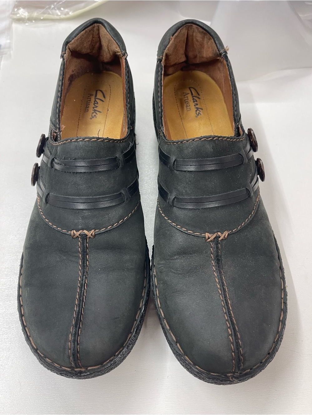 Clarks Artisan women's black leather slip-on‎ shoes with button details